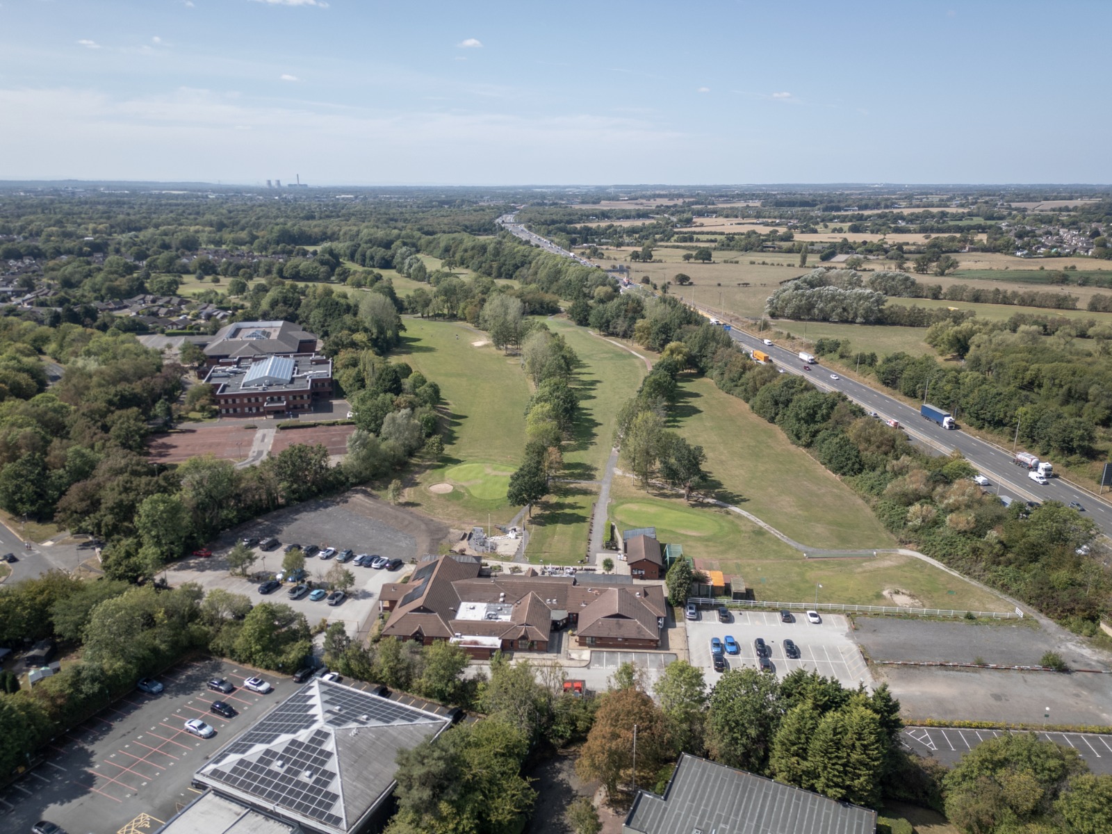 Same aerial site before the CGI-integrated padel courts