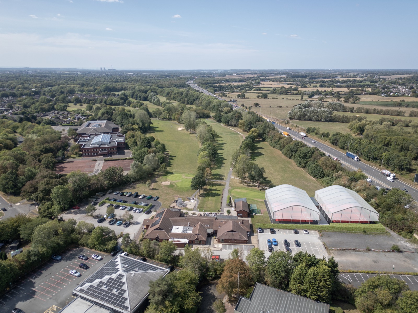 Aerial CGI visualisation showing padel courts integrated into the site